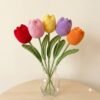 Put_tulip_in_vase_202608311728
